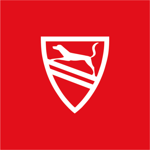 Uz sarkana fona balts ģerbonis. Ģerbonī pa vidu divas slīpas līnijas. Uz aug&scaron;ējās līnijas suņa atveidols.